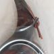 Picks up new vintage shovel and sweeper crumbs