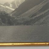 Photo in black and white mountain lake in golden frame