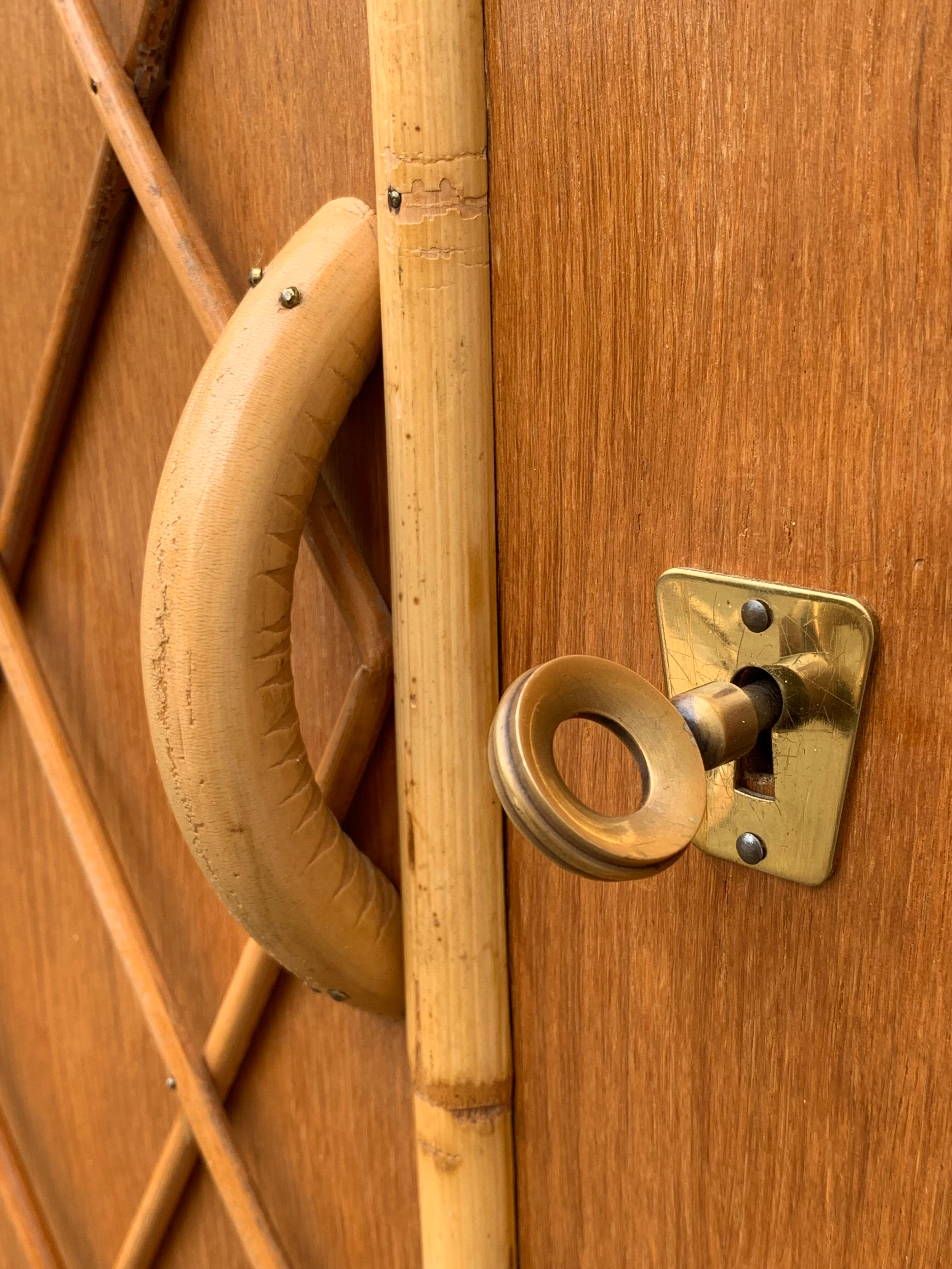 Rattan wardrobe with tapered legs from the 1960s.