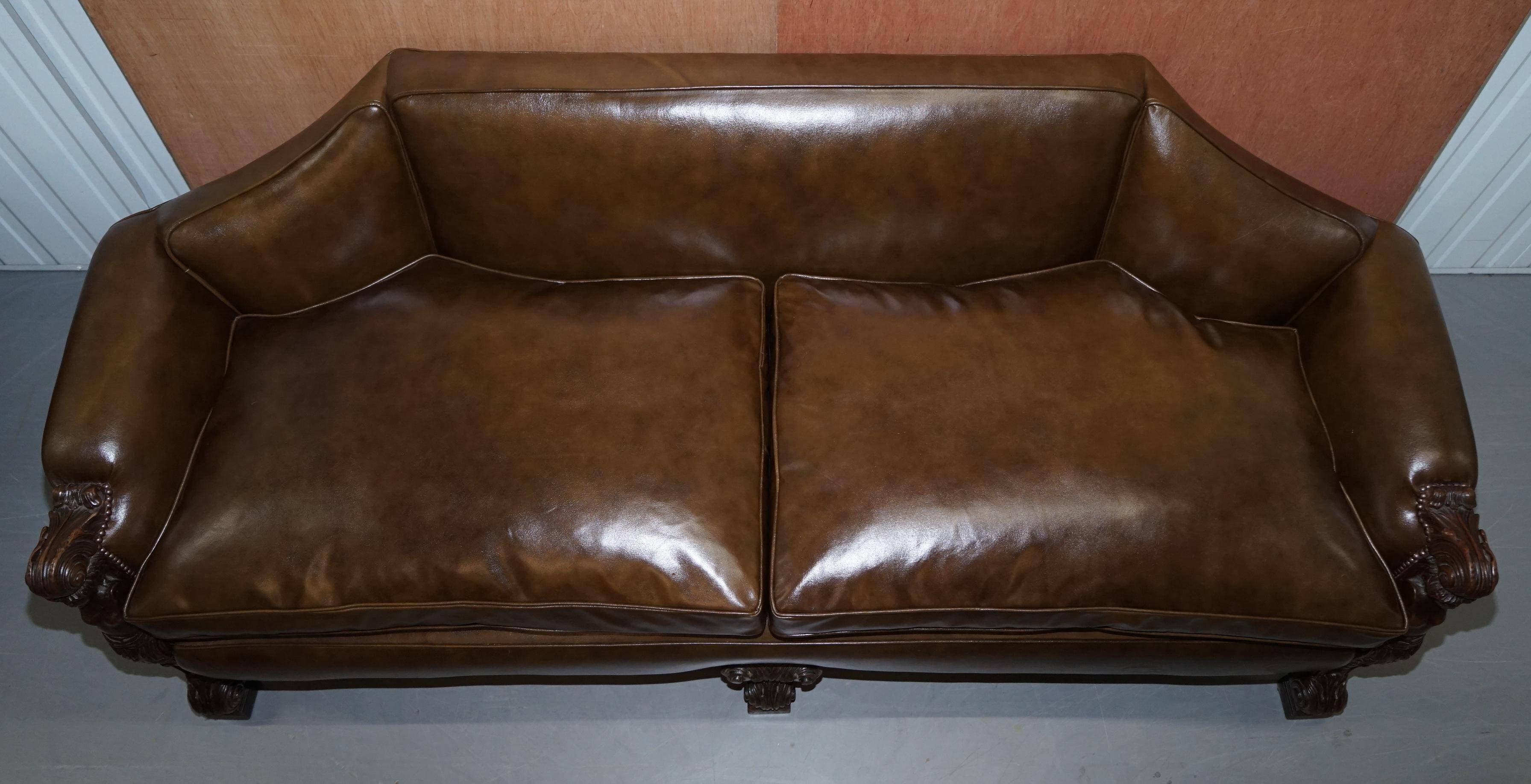 Restored Regency canapé in leather with sculpted Hermès frame.