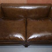 Restored Regency canapé in leather with sculpted Hermès frame.
