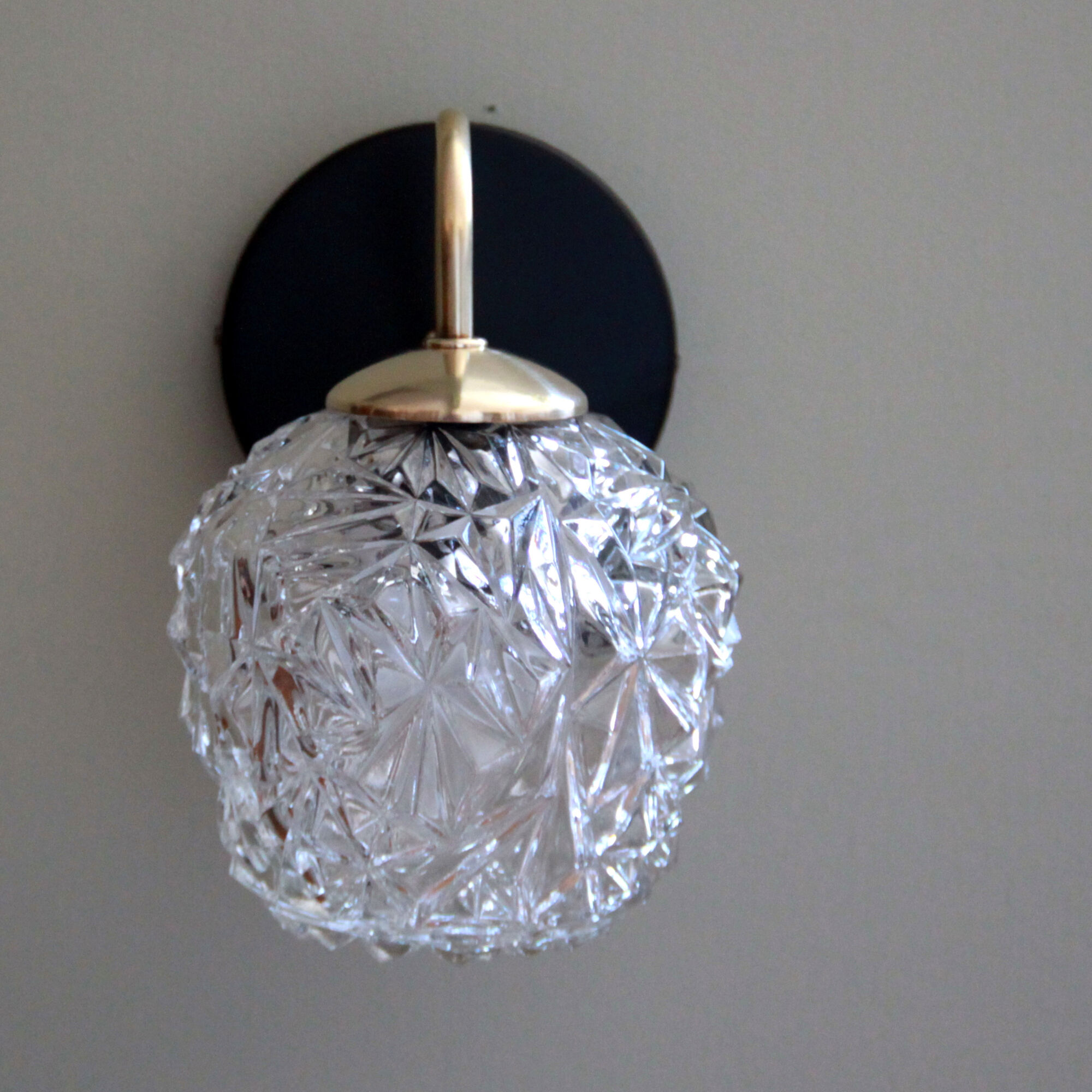 Pair of brass wall sconces and thick glass globe vintage luminaire