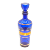 Blue glass decanter with gold decoration