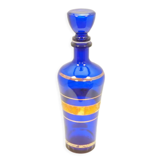Blue glass decanter with gold decoration