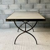 Table made of wrought iron and cement