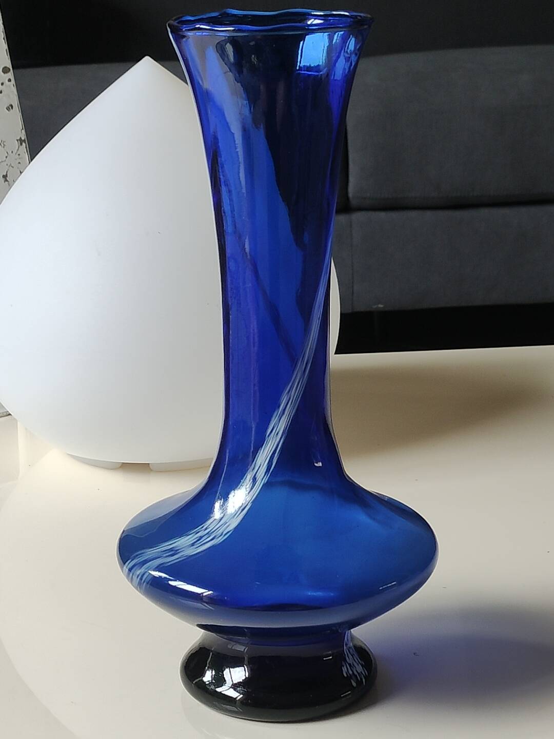 Long flared neck ball vase. Smoked scrolls in cobalt blue art glass, 30cm