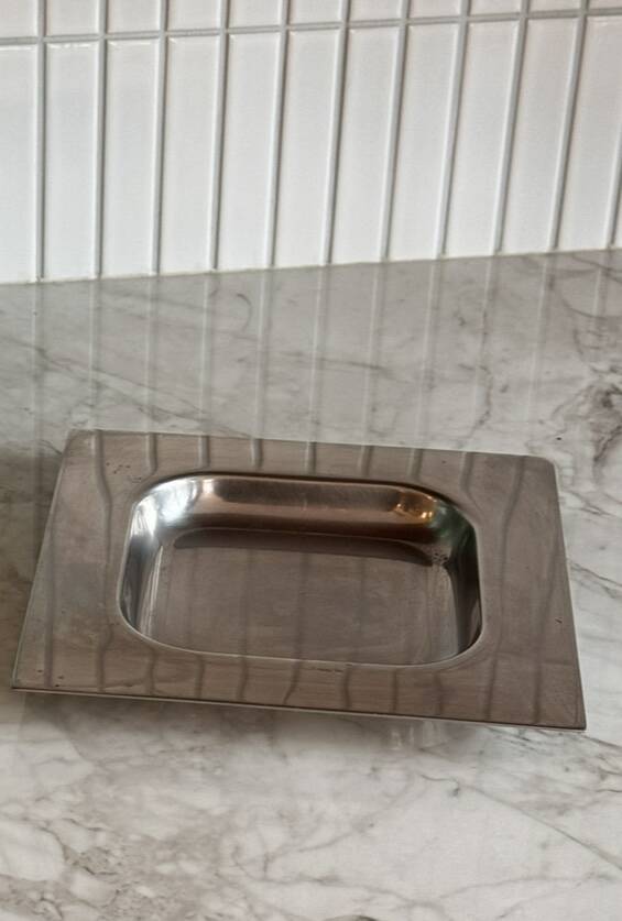Minimalist stainless steel pocket emptier
