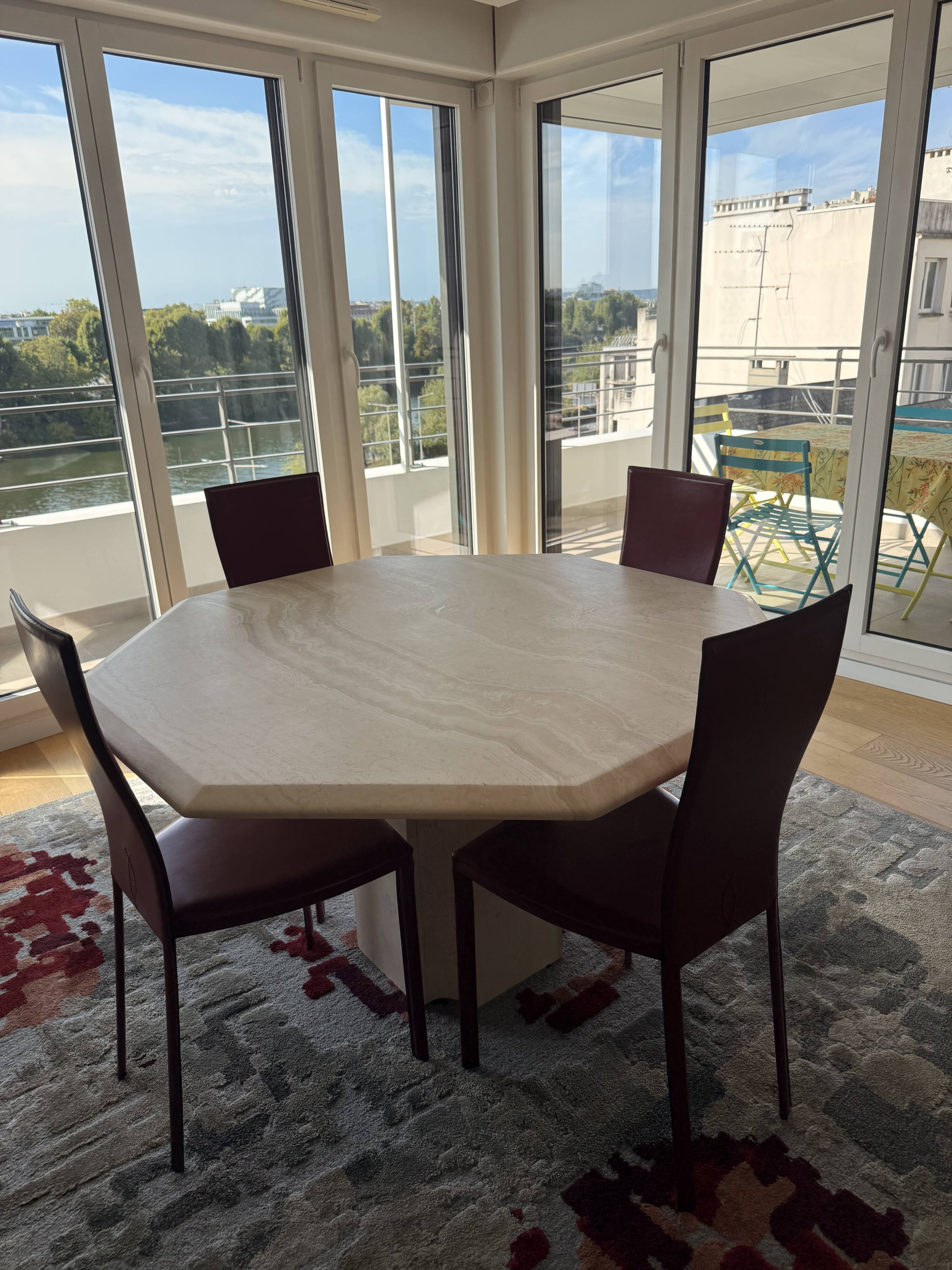 Table octogonale en travertin 130 cm Artelano état neuf