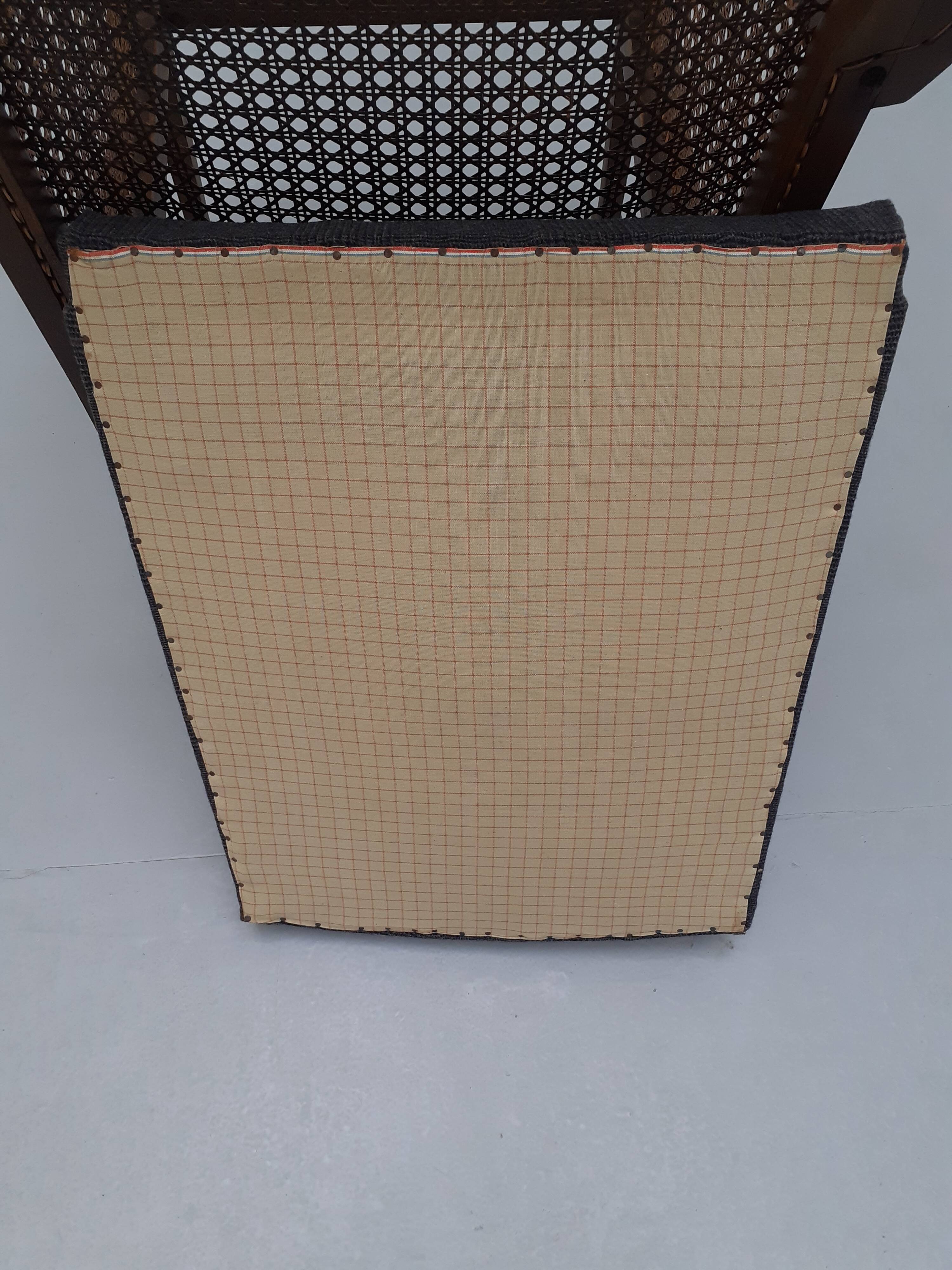 Colonial wooden armchair and cannage