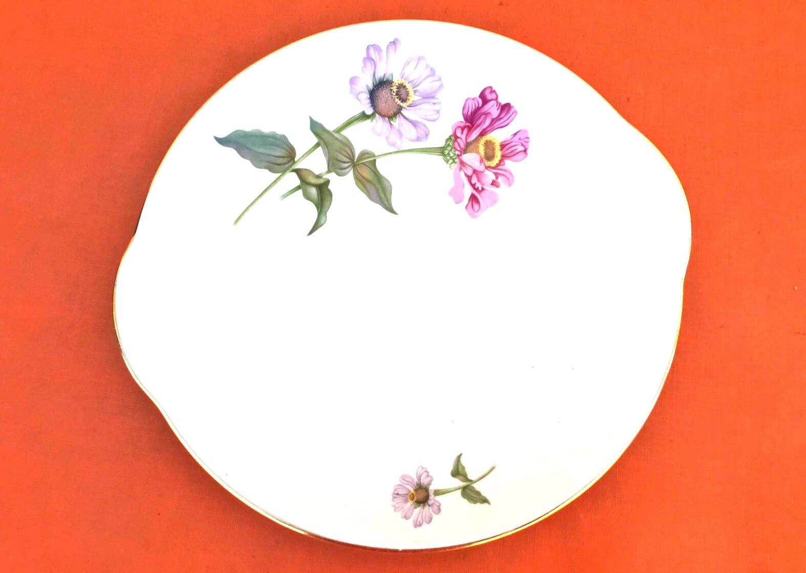 Serving dish with handles, fine Bohemian porcelain with floral decoration on a background.