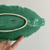 Green earthenware dish in the shape of a leaf