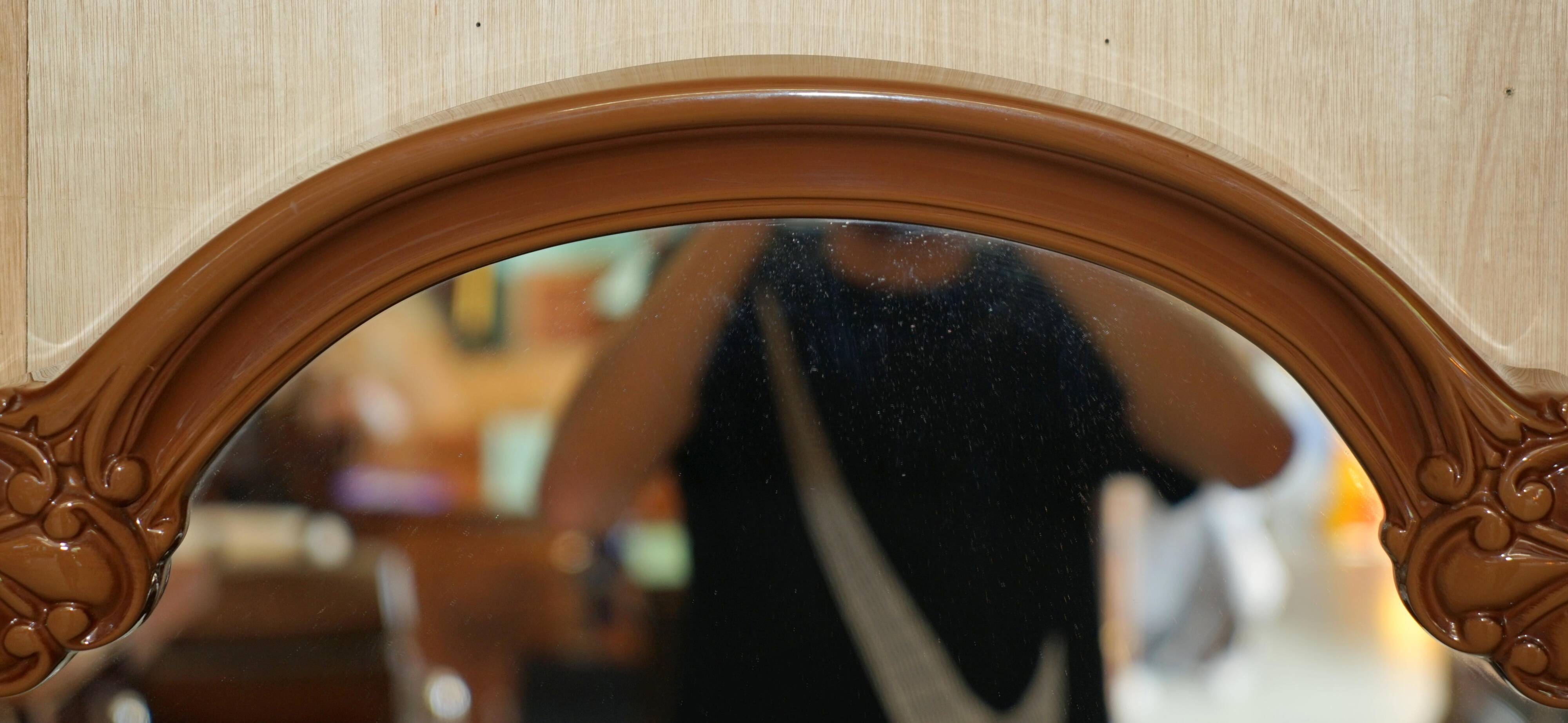 Vintage Art Deco decorative mirror with a thick frame.