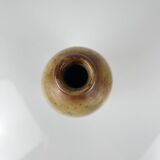 Duo of speckled stoneware and burgundy bottles, 20th century