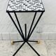Wrought iron stela and black and white tiled top from the 1960s.