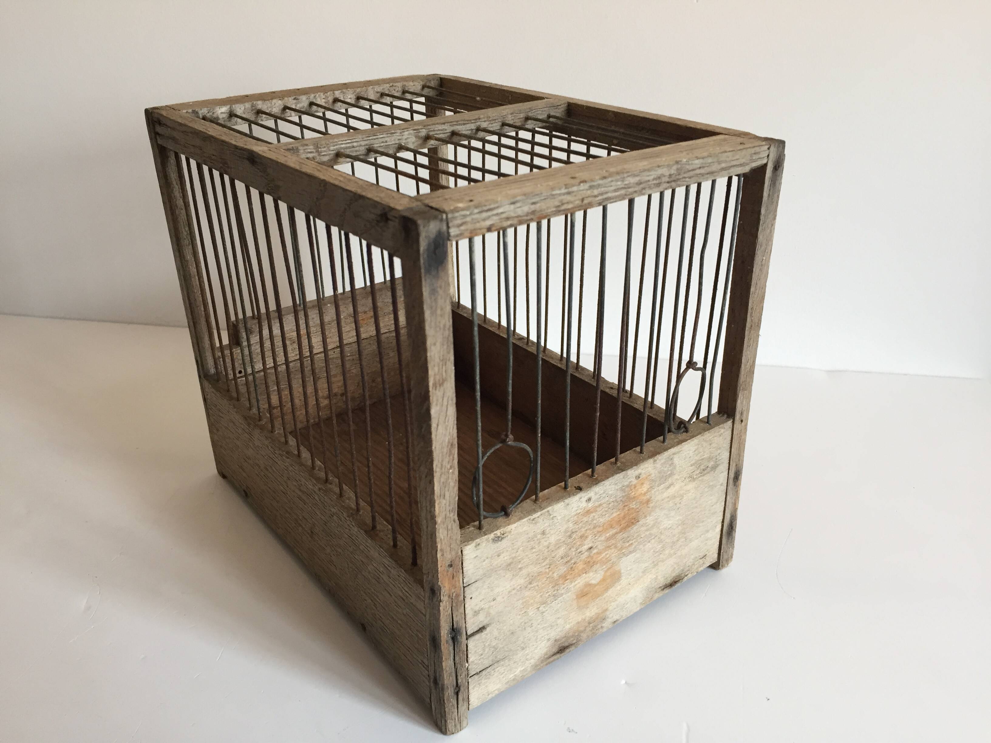 Old bird cage in wood and steel