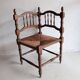 Antique corner chair "fireplace corner" in turned wood and straw.