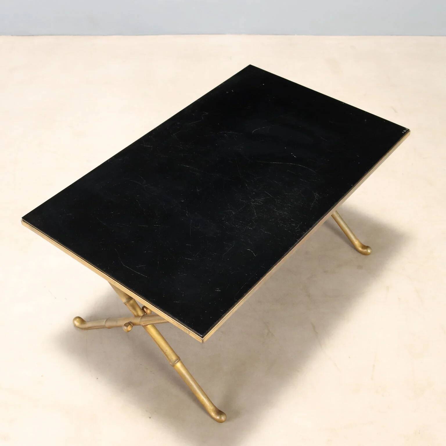 Coffee table from the 1950s-60s with a brass base.