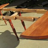 Extendable panel with pans on wheels in cherry