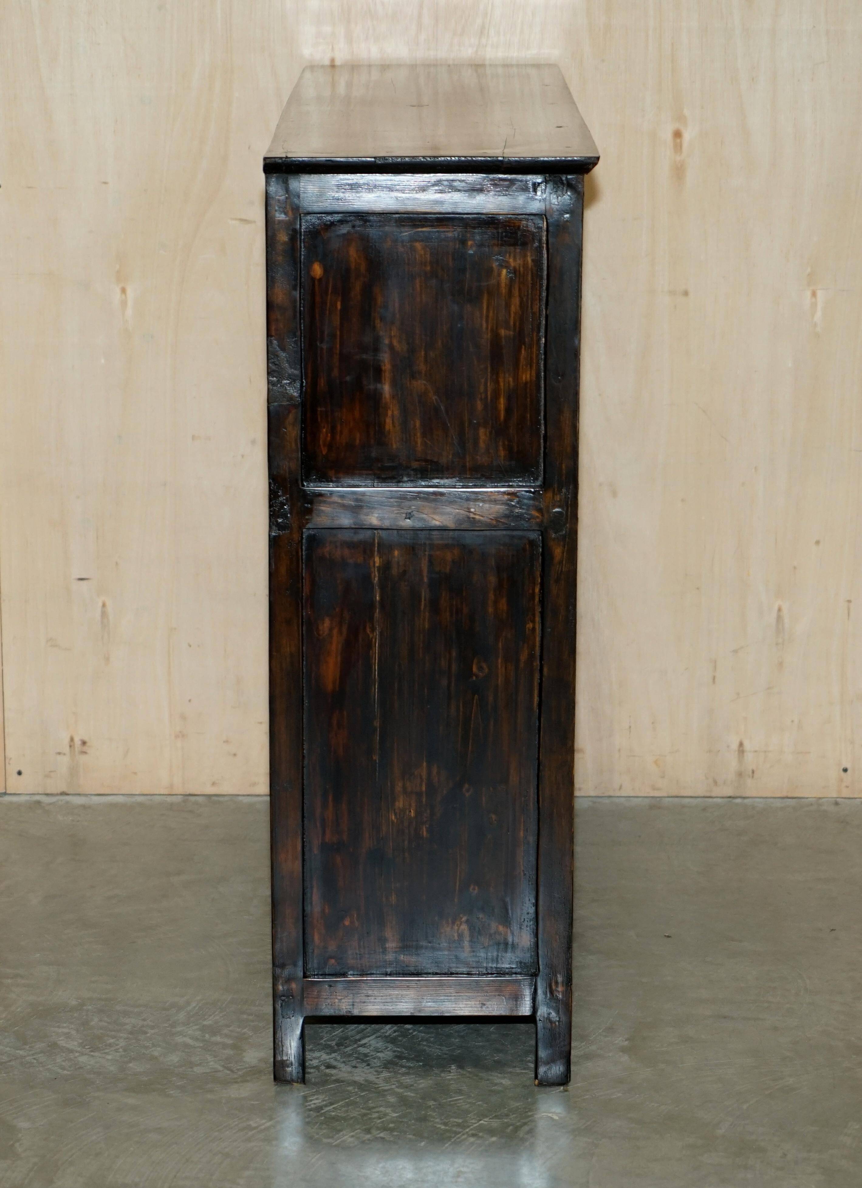 Antique polychrome Tibetan altar cabinet with deer and flowers.