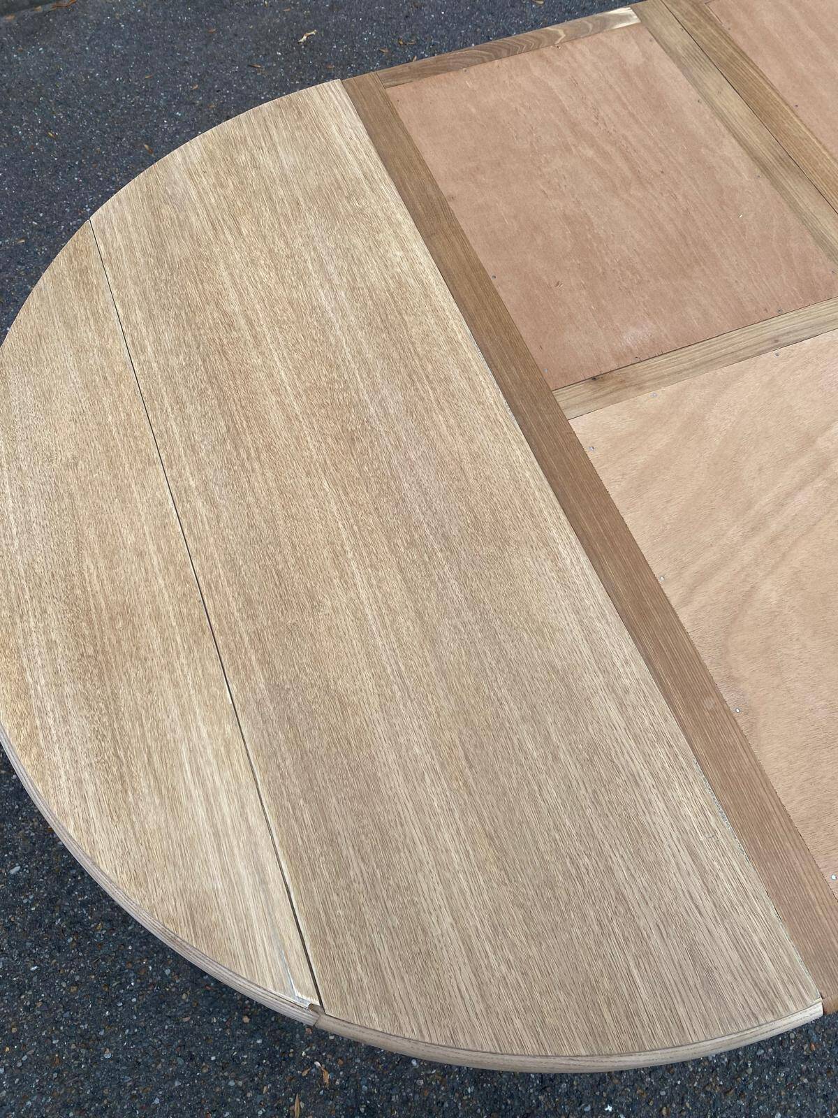 Round dining table with extendable leaves, Louis Philippe style, stripped in raw oak.