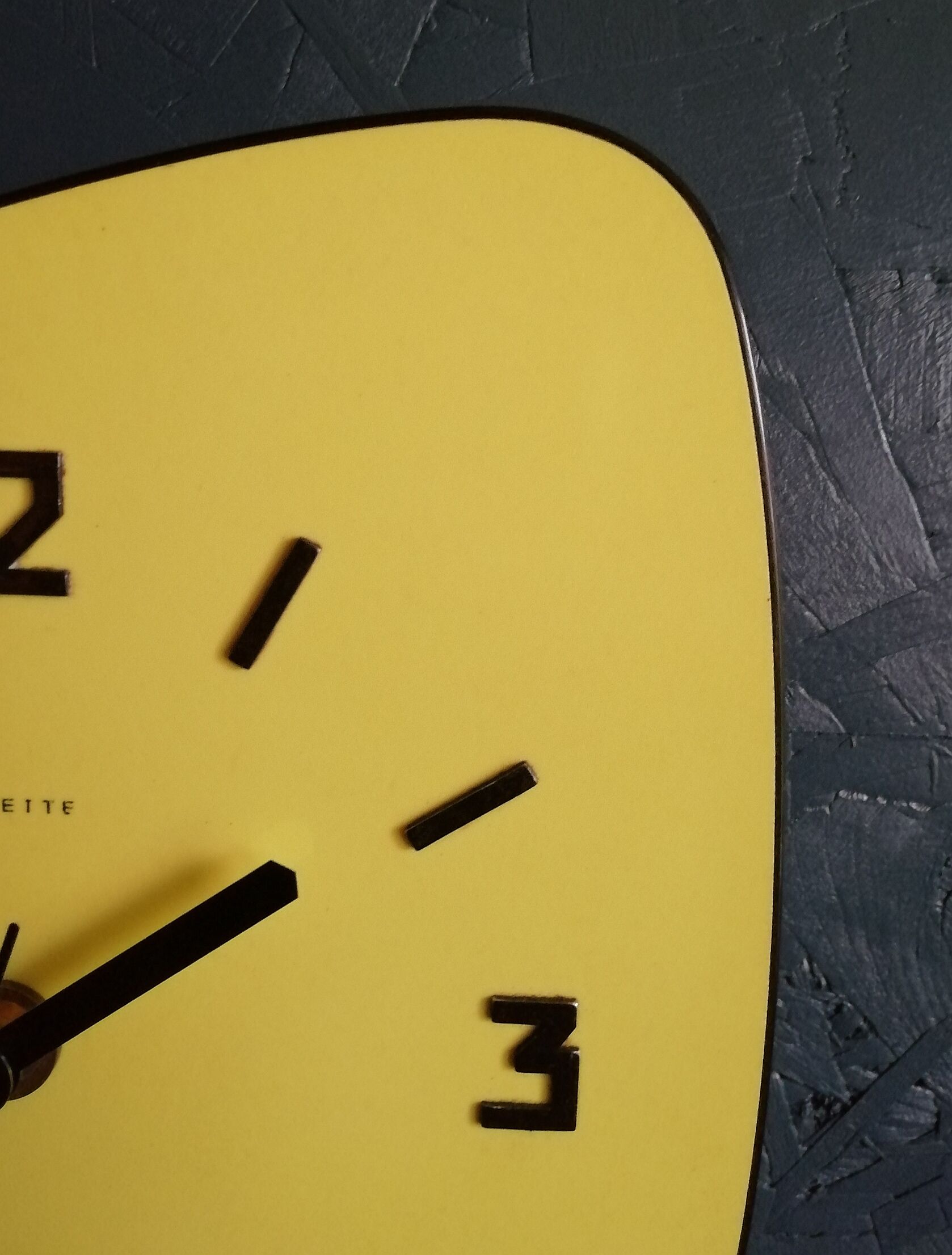 Formica vintage asymmetrical silent wall clock "Yellow Star"