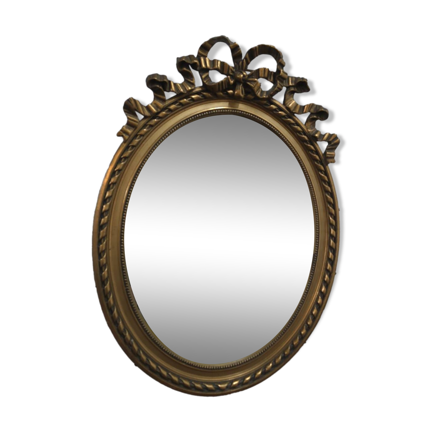 Oval mirror with gold patina