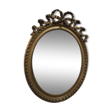 Oval mirror with gold patina