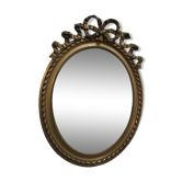 Oval mirror with gold patina
