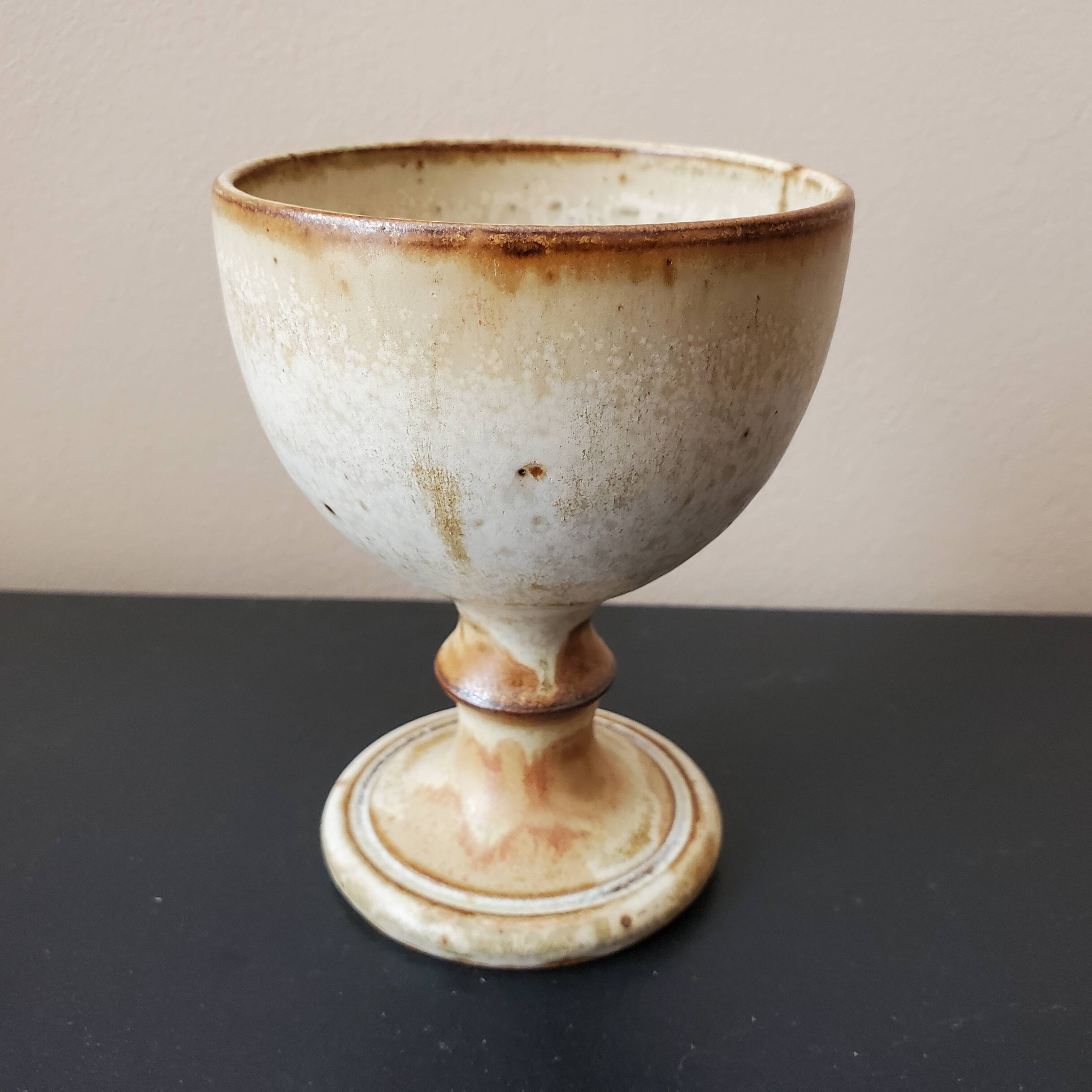 Old glazed sandstone chalice glass