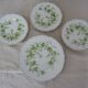 6 flat plates and 1 round dish haviland limoges with green and gold horn