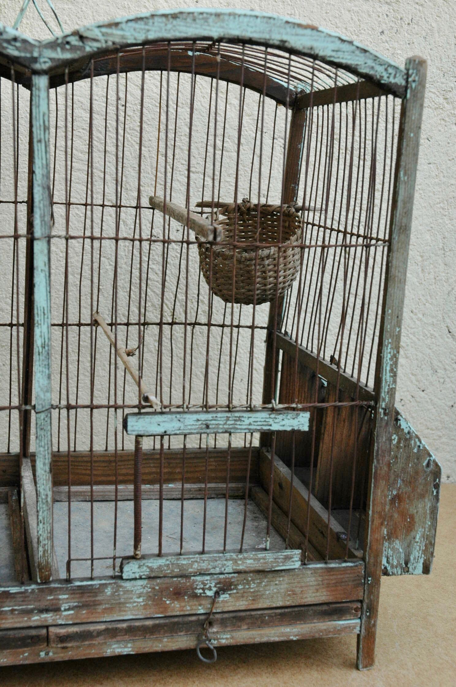 Ancient bird cage in wood and metal