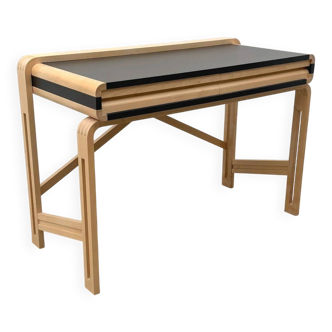Solid wood and formica desk made by a cabinetmaker.