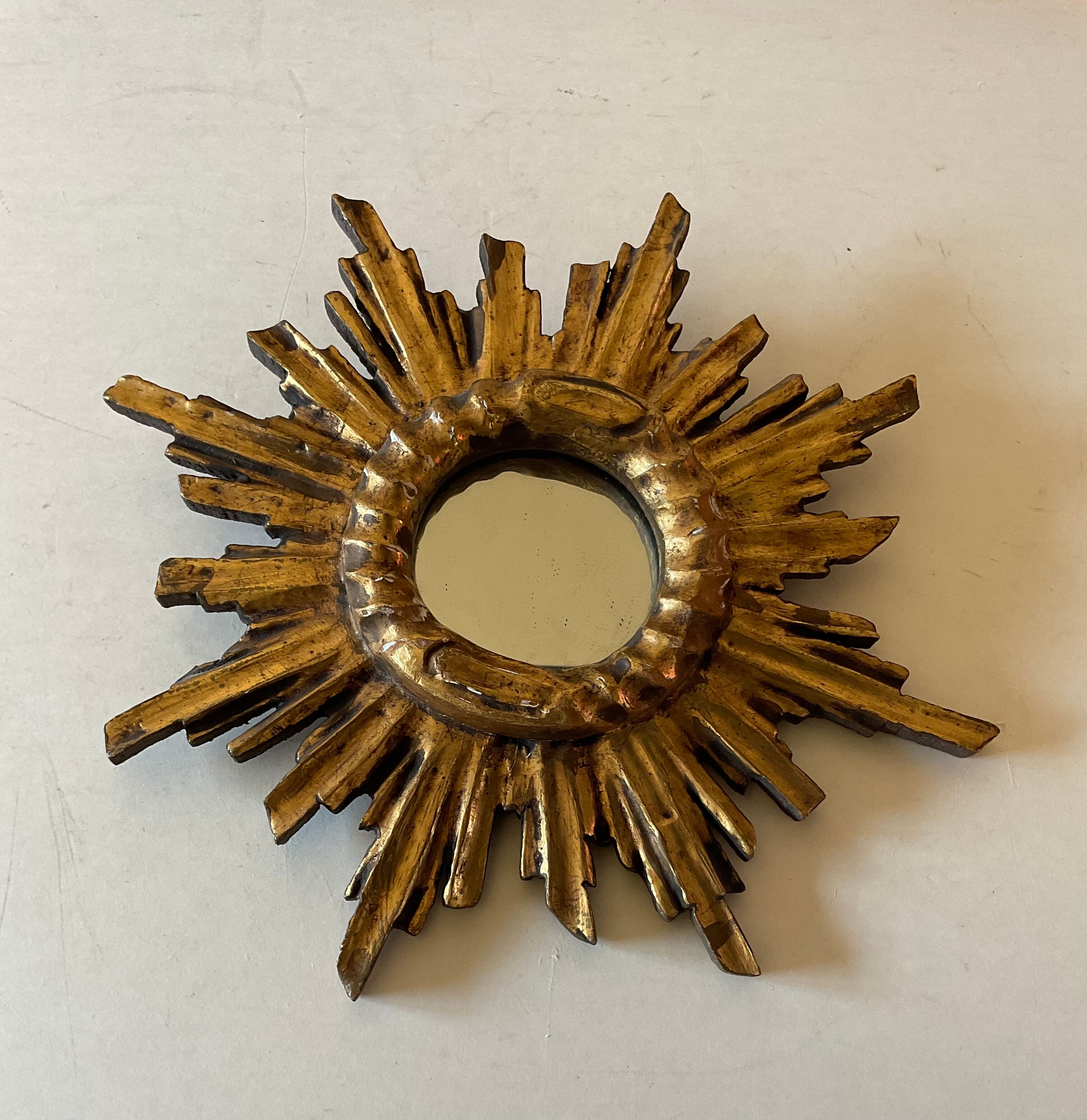 Miroir soleil vintage en bois doré