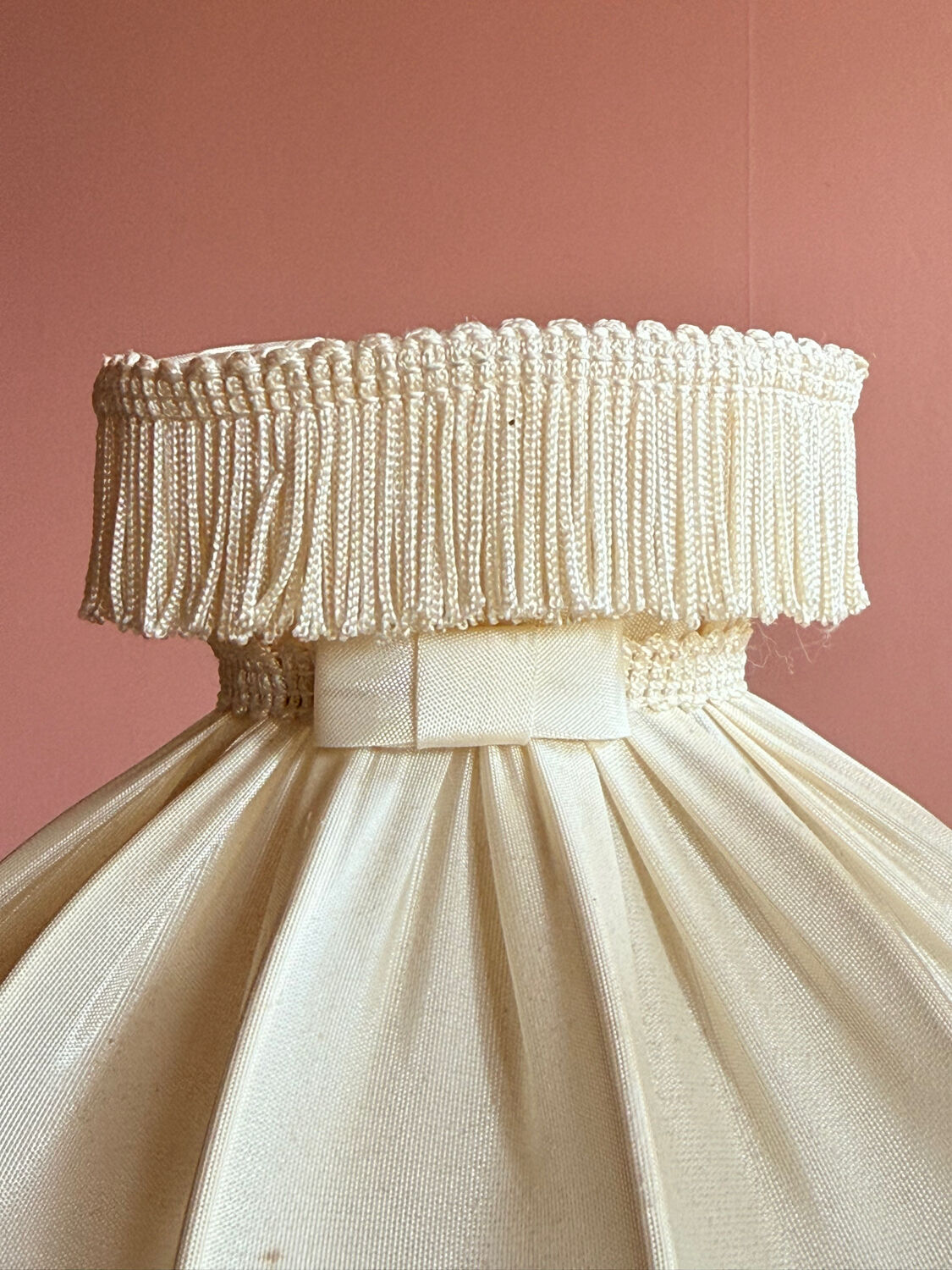 Fringed white bedside lamp