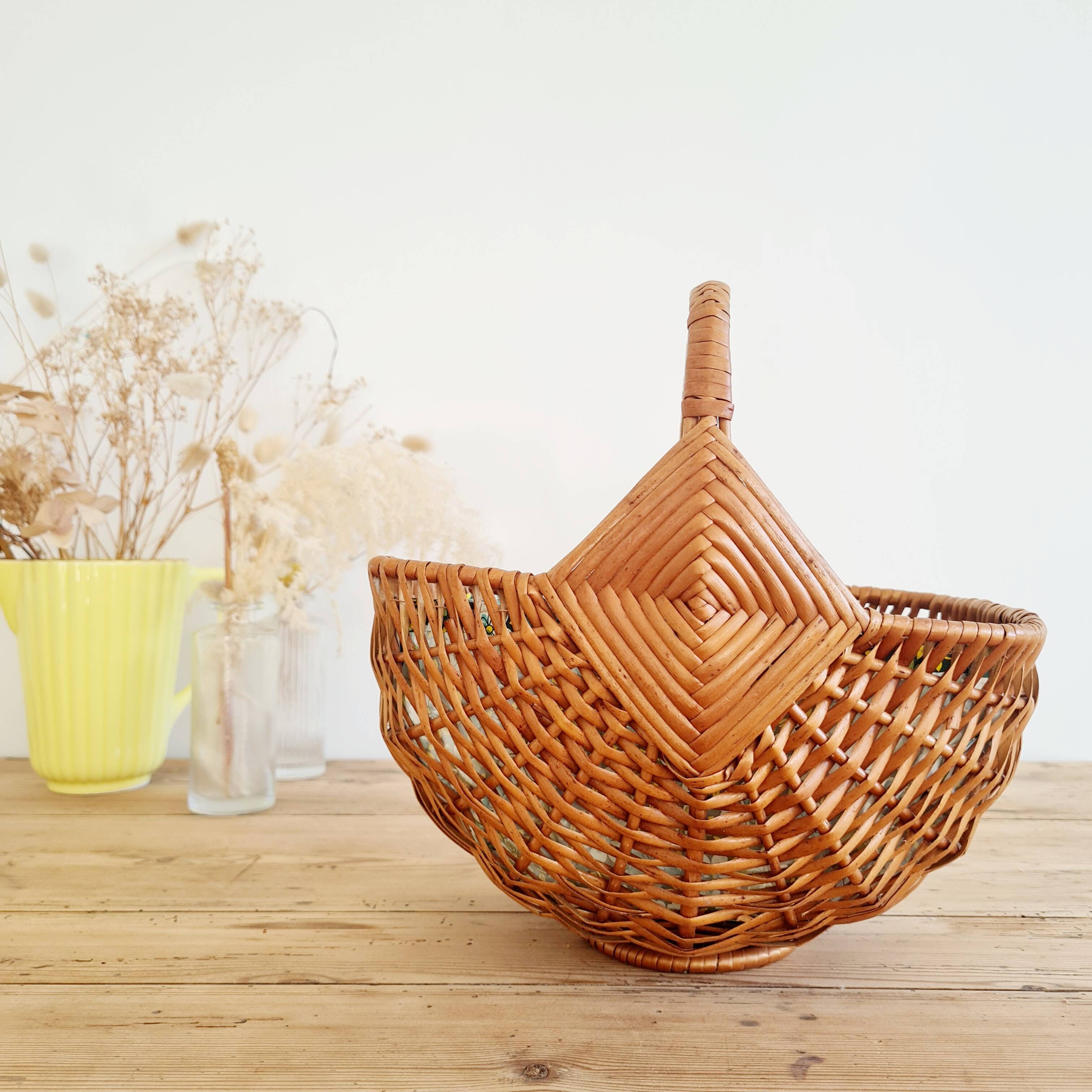 Small old basket with floral fabric interior