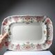 Antique Longchamp serving platter with polychrome daisies in ironstone.
