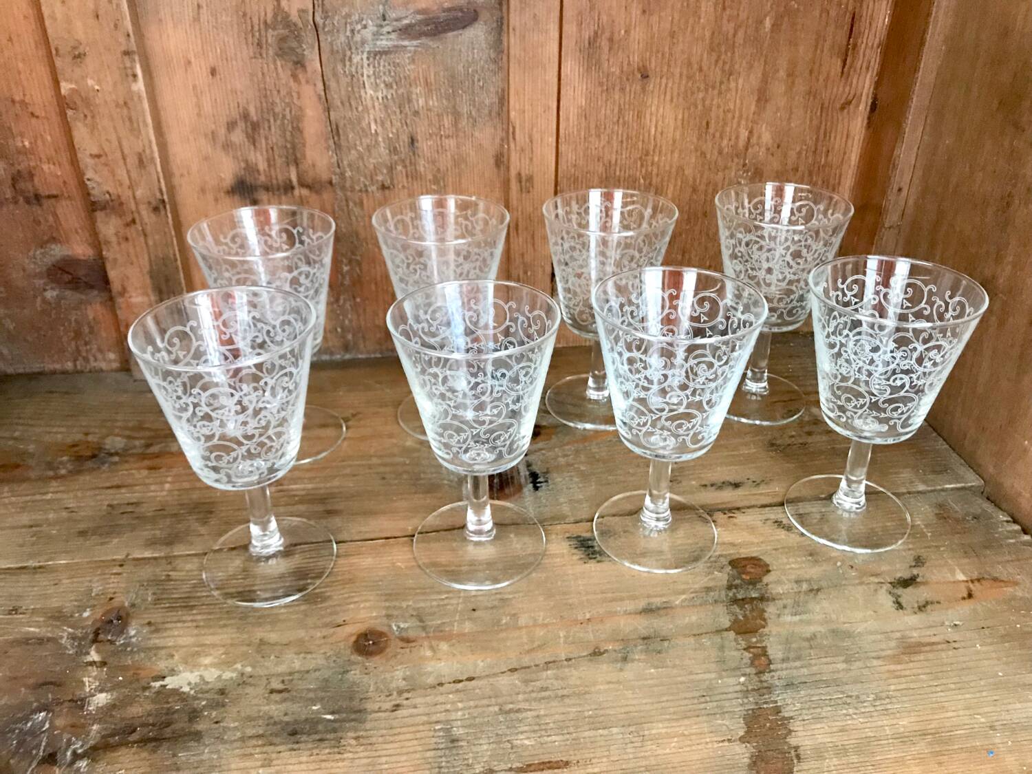Set of old glasses with white arabesque pattern