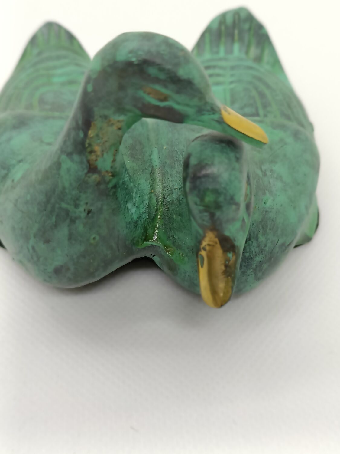 Two green and golden ducks in brass