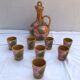 Old carafe with 8 ceramic glasses