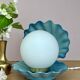 Vintage lamp in the shape of a shell in blue and opaline ceramic.
