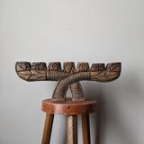Hand-carved wooden candle holder, ethnic tribal style.