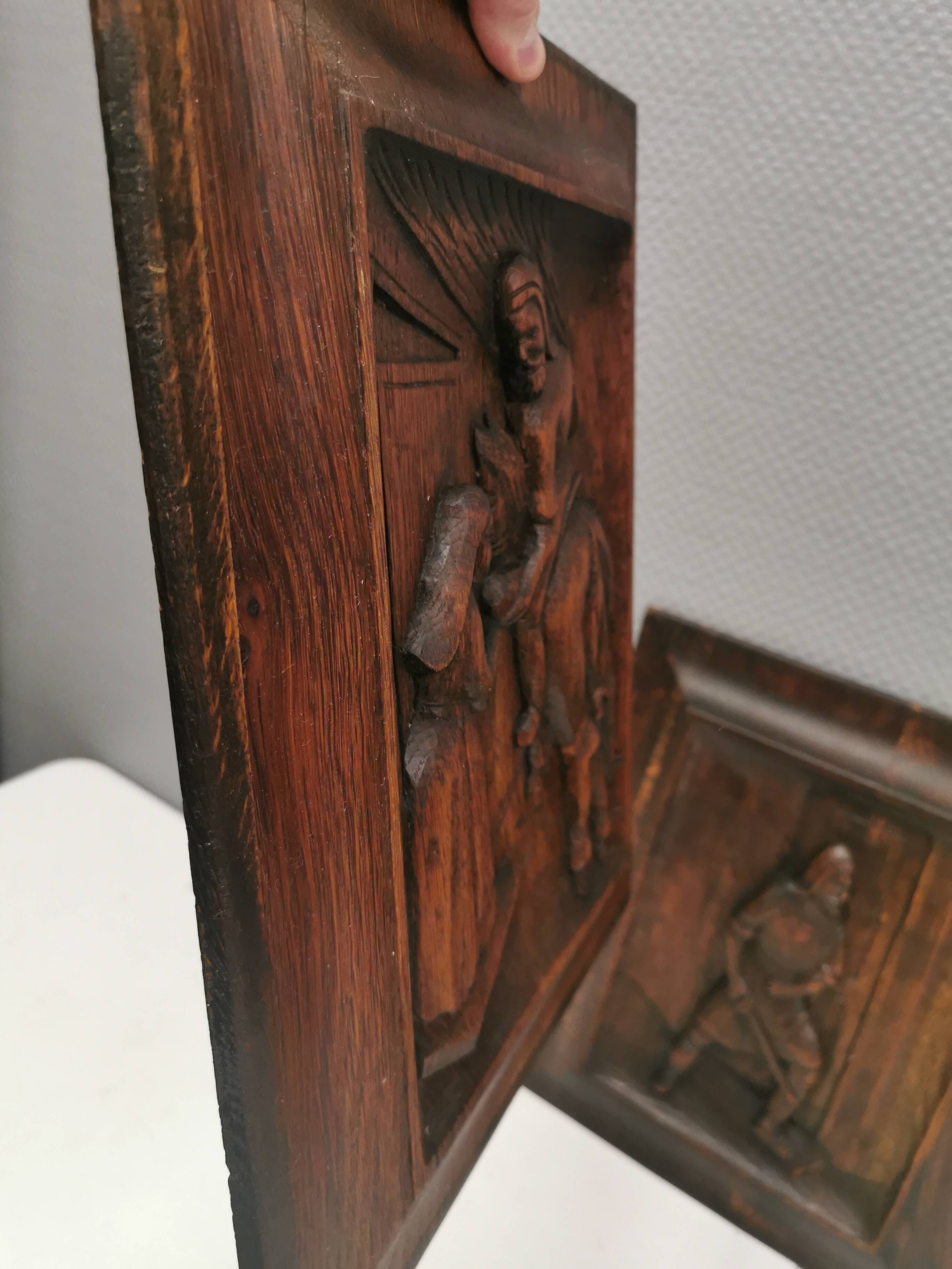 Four old wooden carvings to hang on the wall.