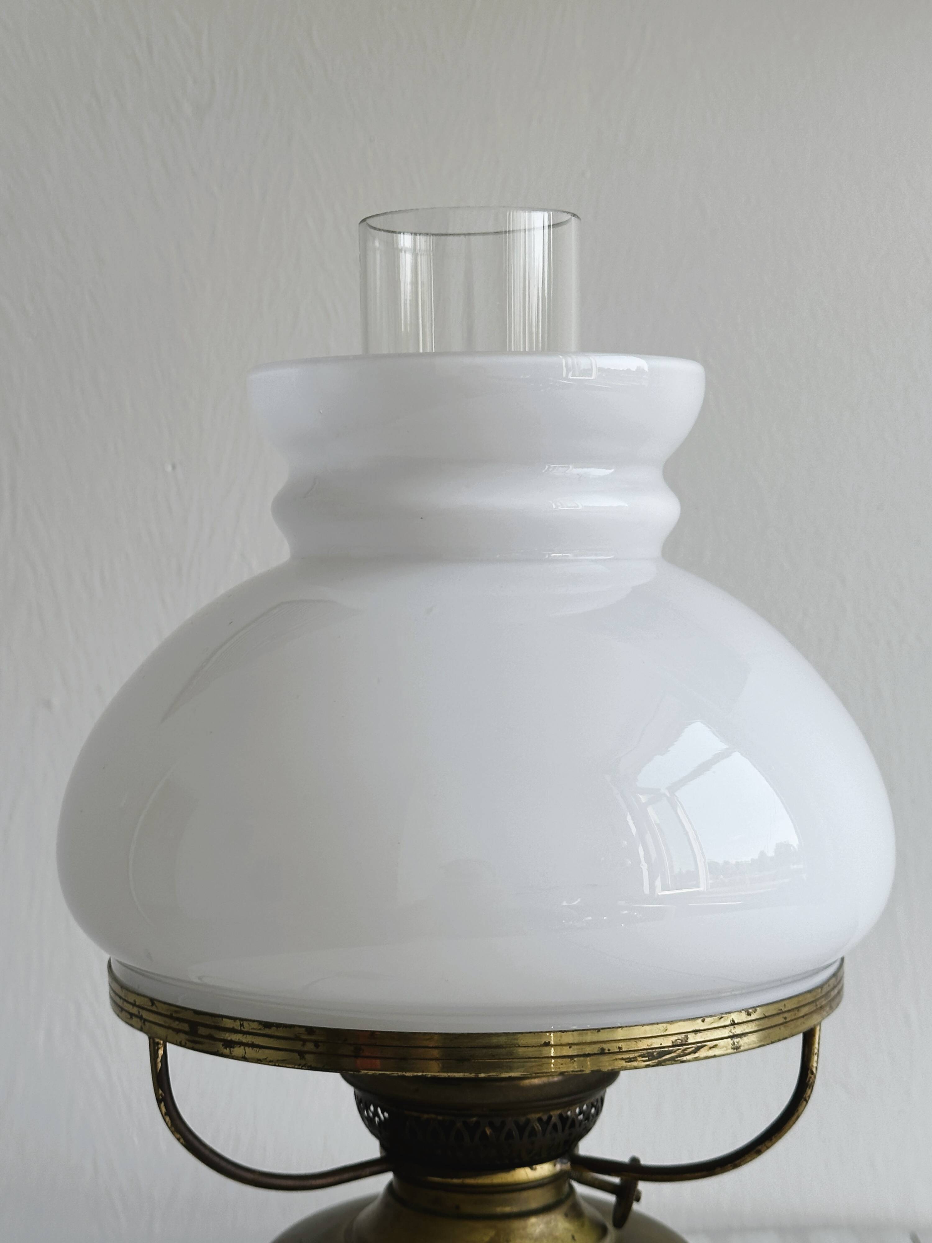 Vintage brass lamp with white opaline glass shade.