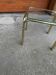 Vintage 1970s coffee table in gilded brass with a transparent glass top — straw yellow.