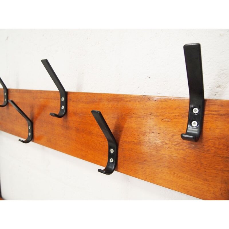 Locker room in gym with rail for coats