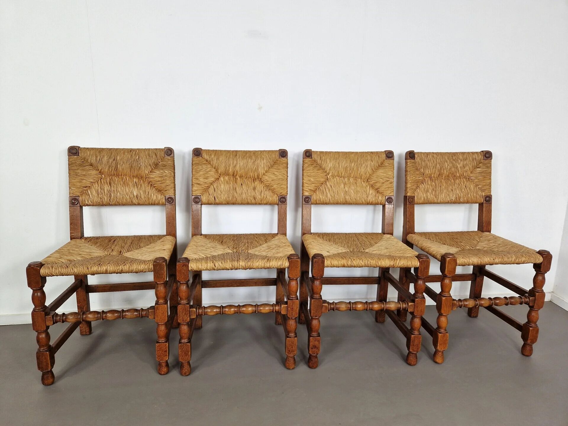 Set of French primitive rush chairs | 1930s