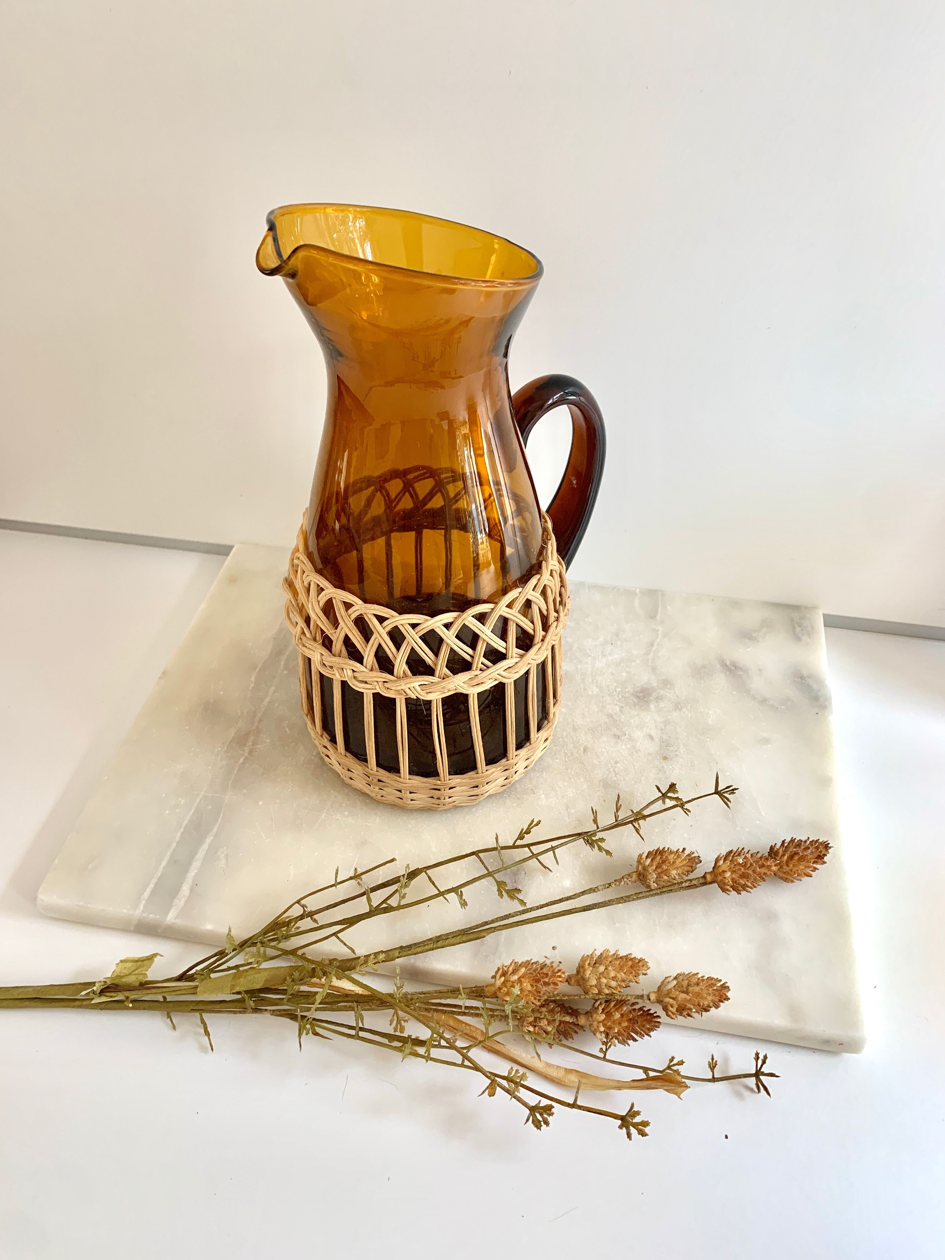 Amber glass and wicker carafe