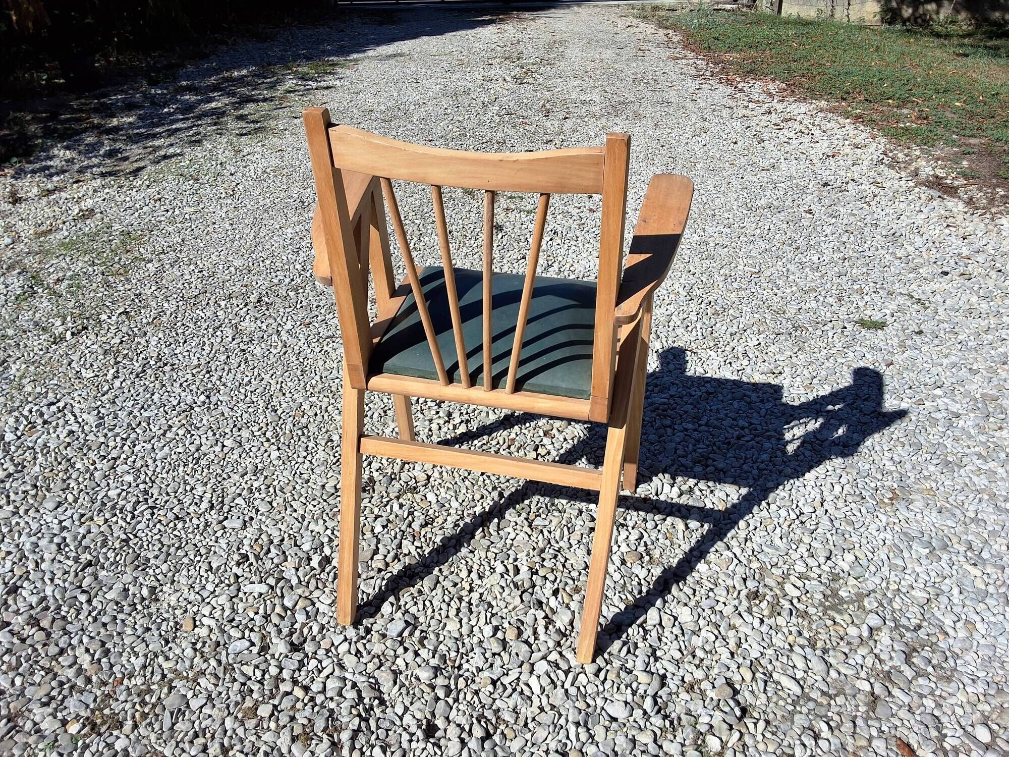 Compass leg armchair