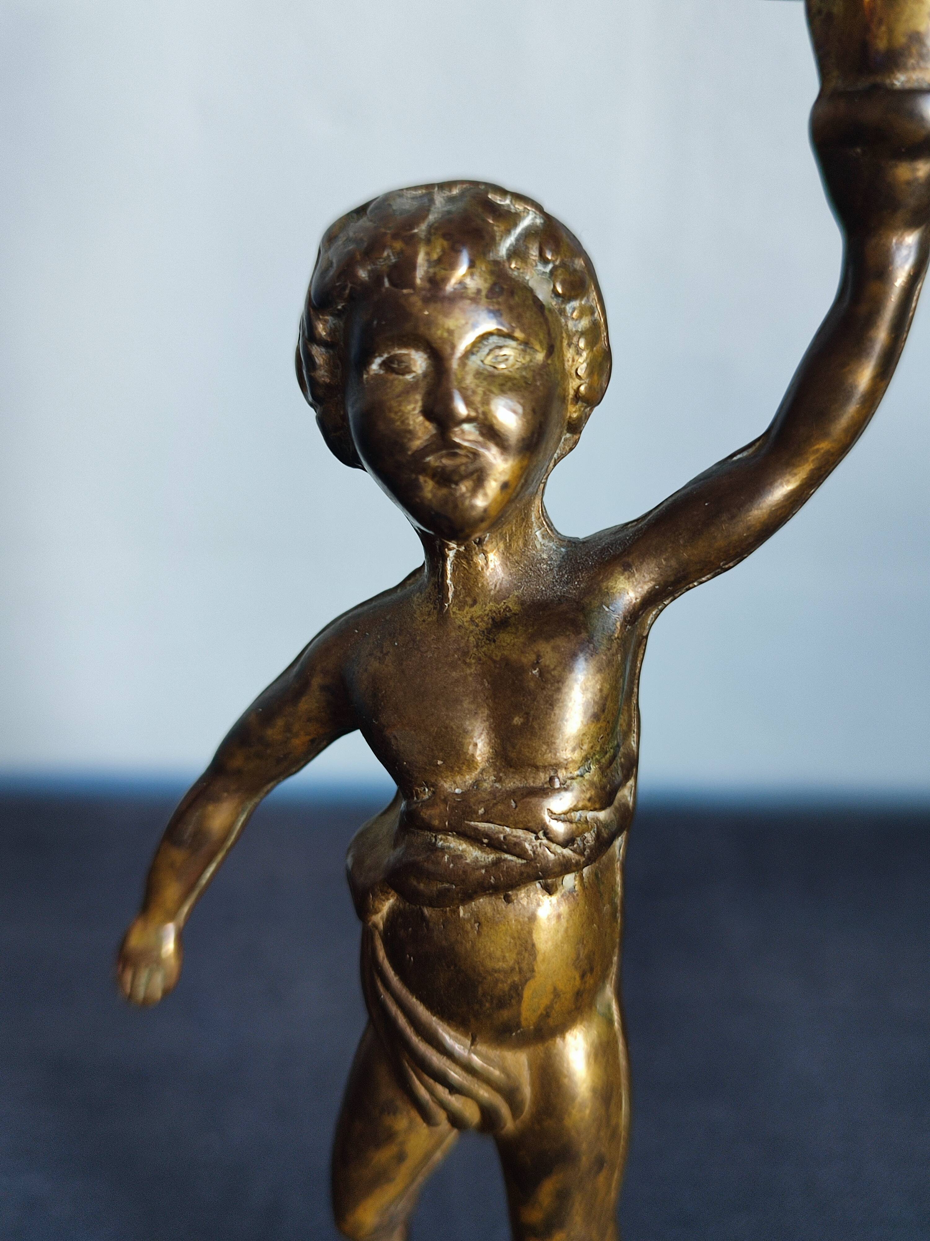 Set of two cherub cherub candlesticks