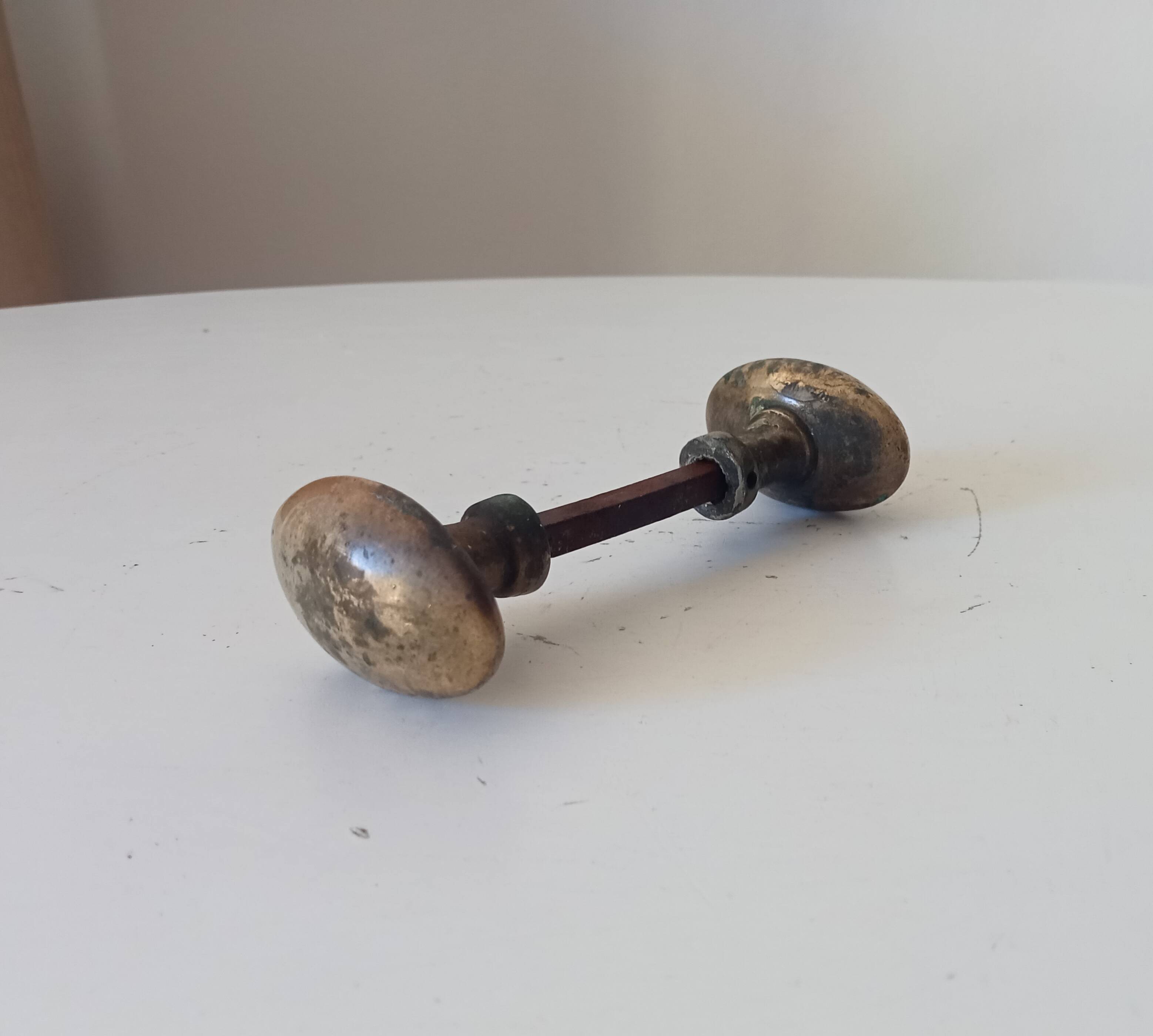 Pair of antique oval door handles in solid brass.